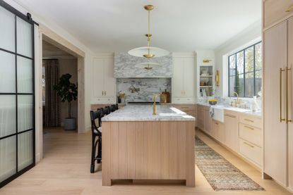 A kitchen designed in light wood