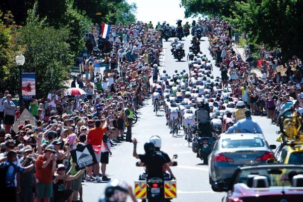 Huge crowds send the group off on the climb.