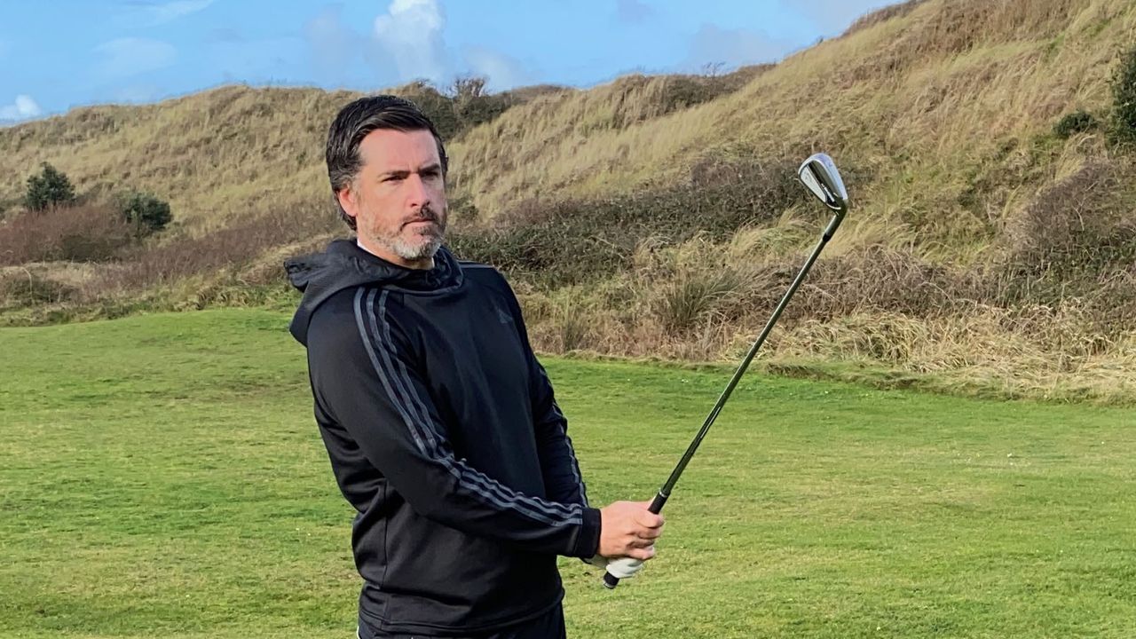 Photo of Joe Ferguson testing the club