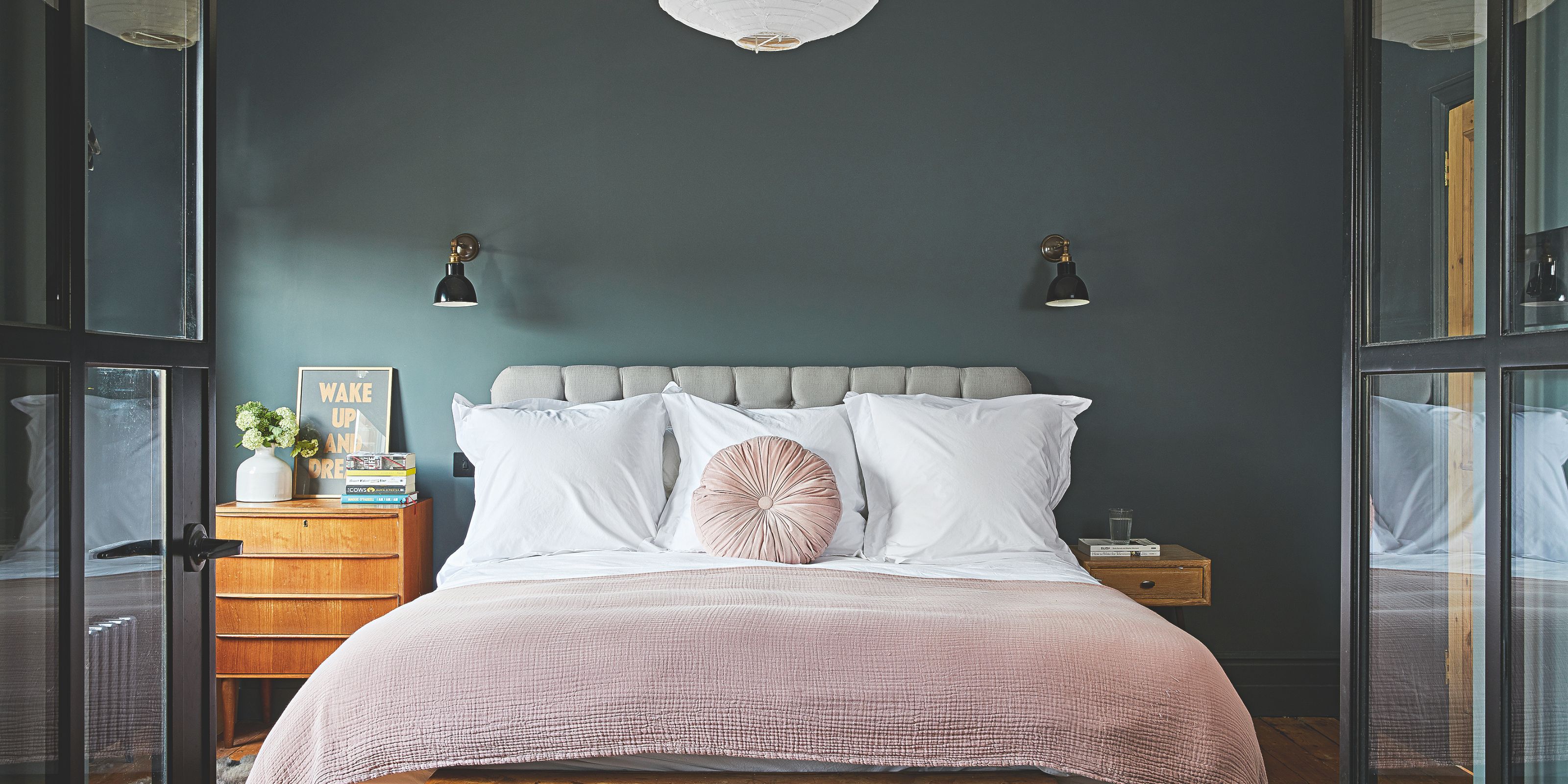 A deep navy modern luxe bedroom scheme