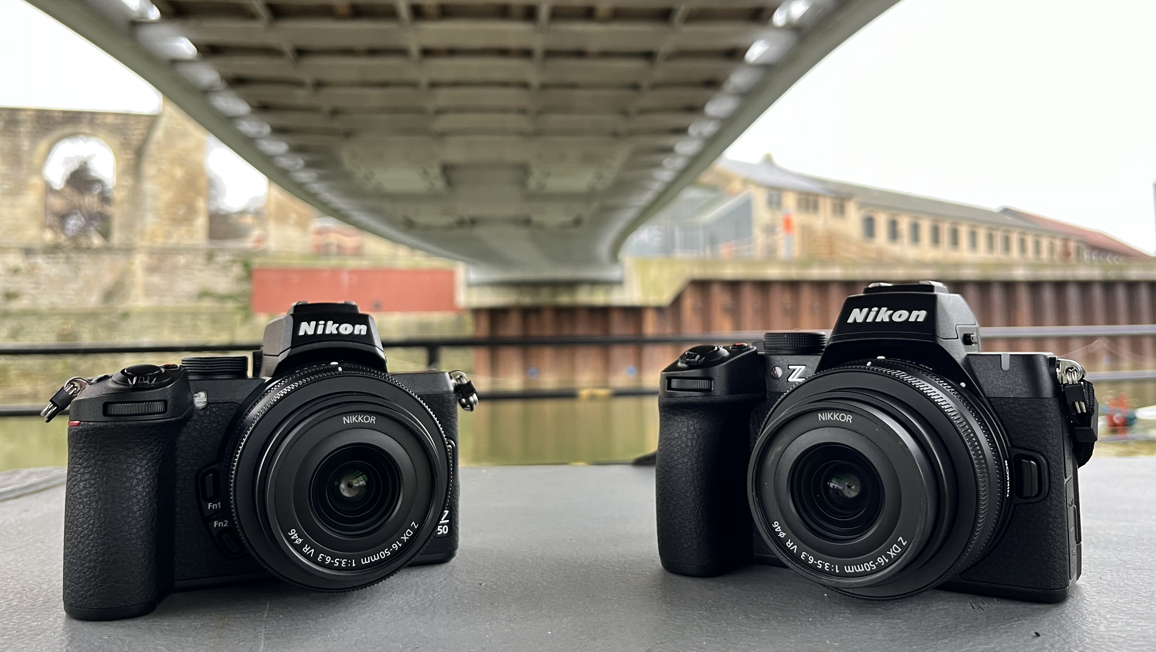 Nikon Z50 next to Nikon Z50 II under bridge