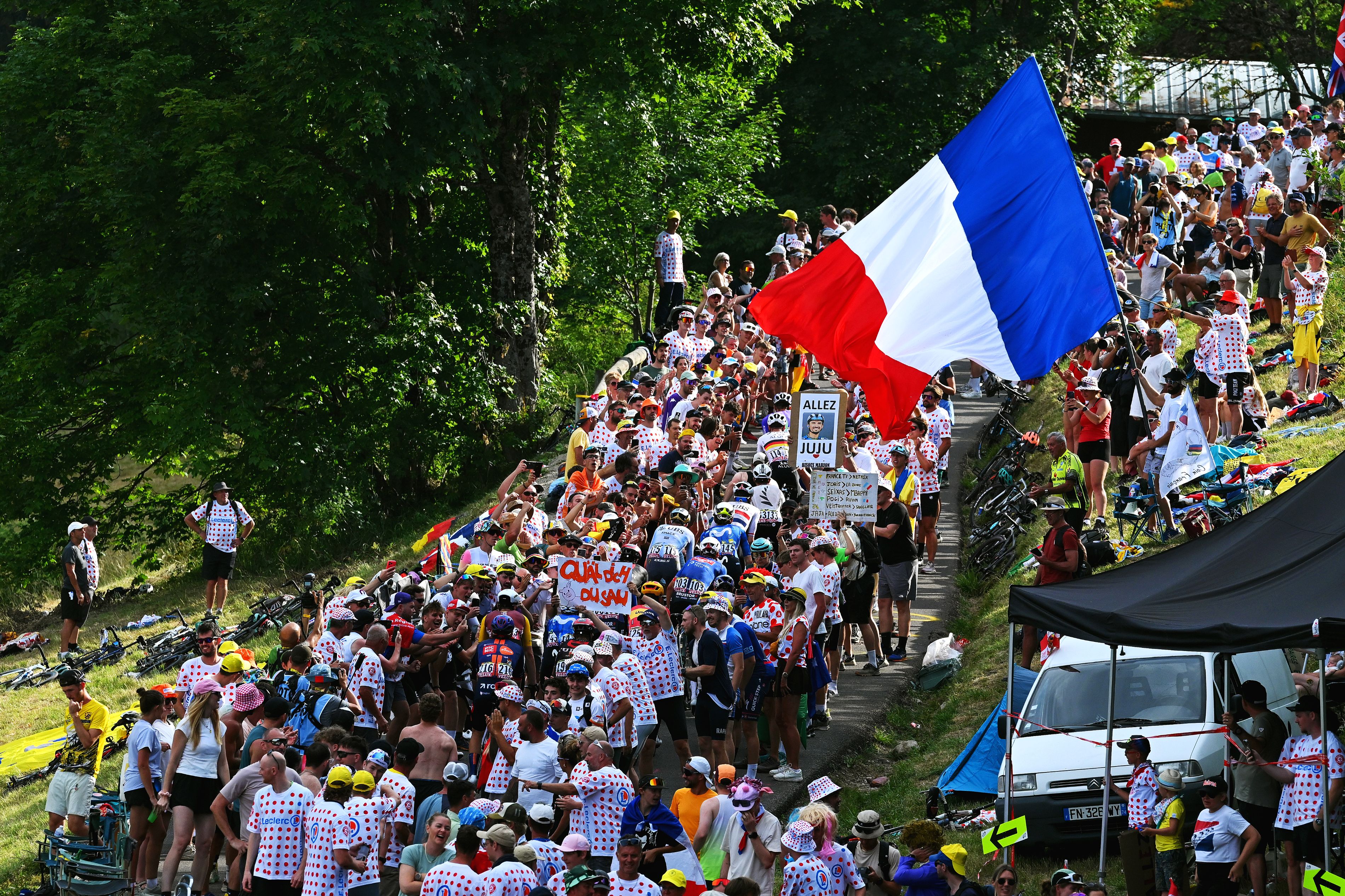 PLATEAU DE SOLAISON, FRANCE - JULY 19: A general view of the peloton competing while fans cheer at the Plateau de Solaison (1501m) during the 113th Tour de France 2026, Stage 15 a 183.9km a 155.3km stage from Champagnole to Plateau de Solaison 1501m / #UCIWT / on July 19, 2026 in Plateau de Solaison, France. (Photo by Tim de Waele/Getty Images)