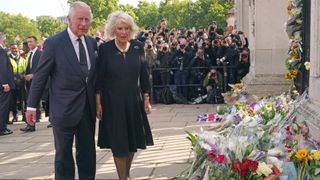 King Charles III and Camilla, Queen Consort view tributes