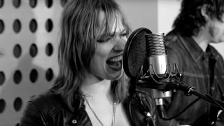 Lzzy Hale from Halestorm singing in a studio