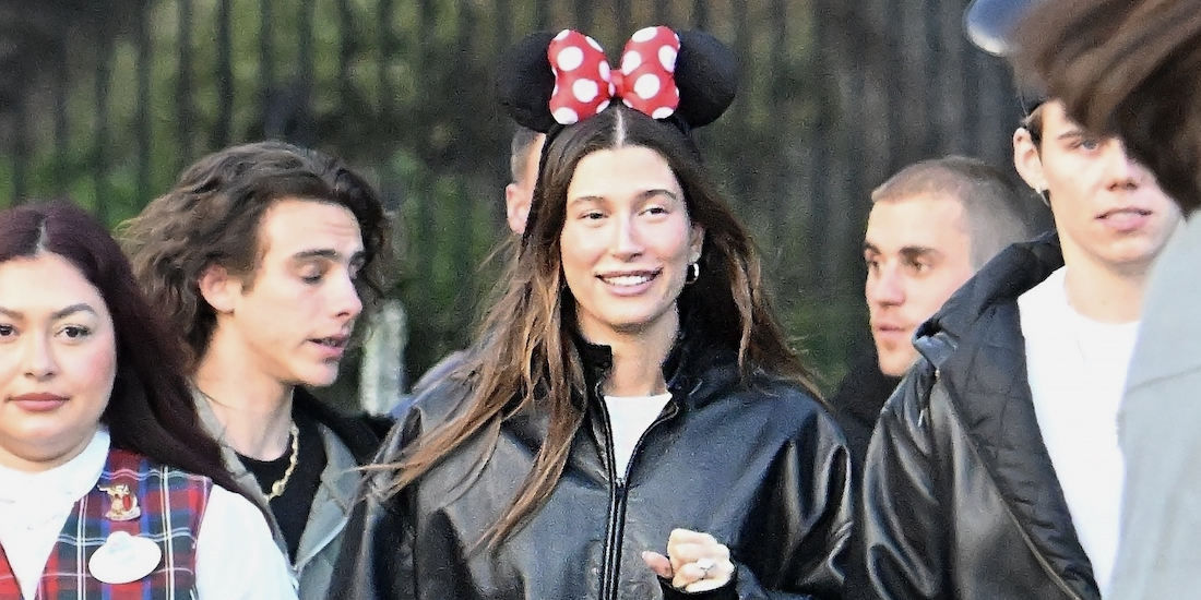 Justin Bieber, Hailey Bieber, and The Kid LAROI enjoy an evening at Disneyland. The group donned Mickey ears and were accompanied by four bodyguards as they made their way through the park, enjoying many of the thrill rides, including Space Mountain and Pirates of the Caribbean.