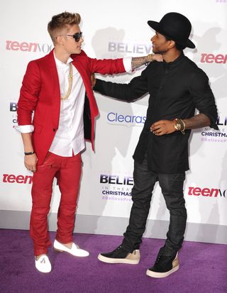 Justin Bieber and Usher arrives at the "Justin Bieber's Believe" World Premiere at Regal Cinemas L.A. Live on December 18, 2013.