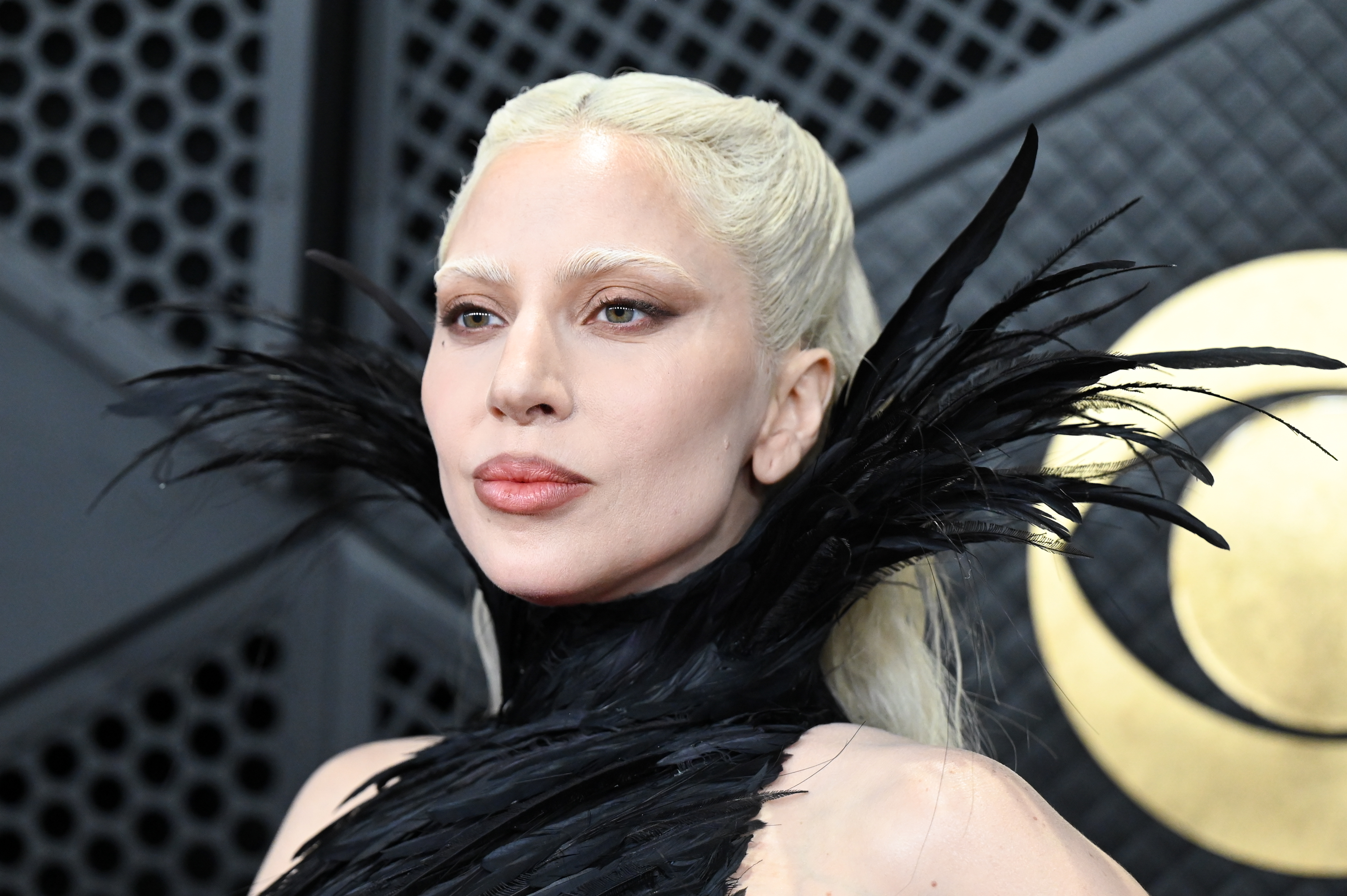 a white woman with platinum blonde hair attends the grammys