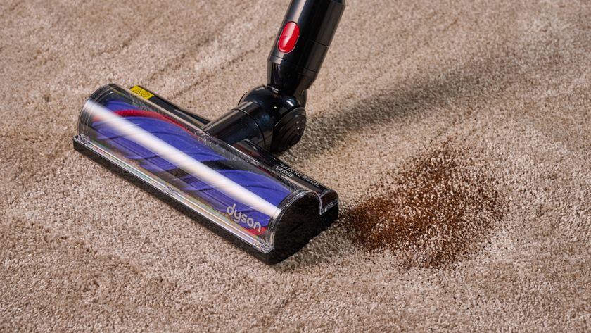 Dyson V8 Cyclone vacuum cleaning fine dust from carpet