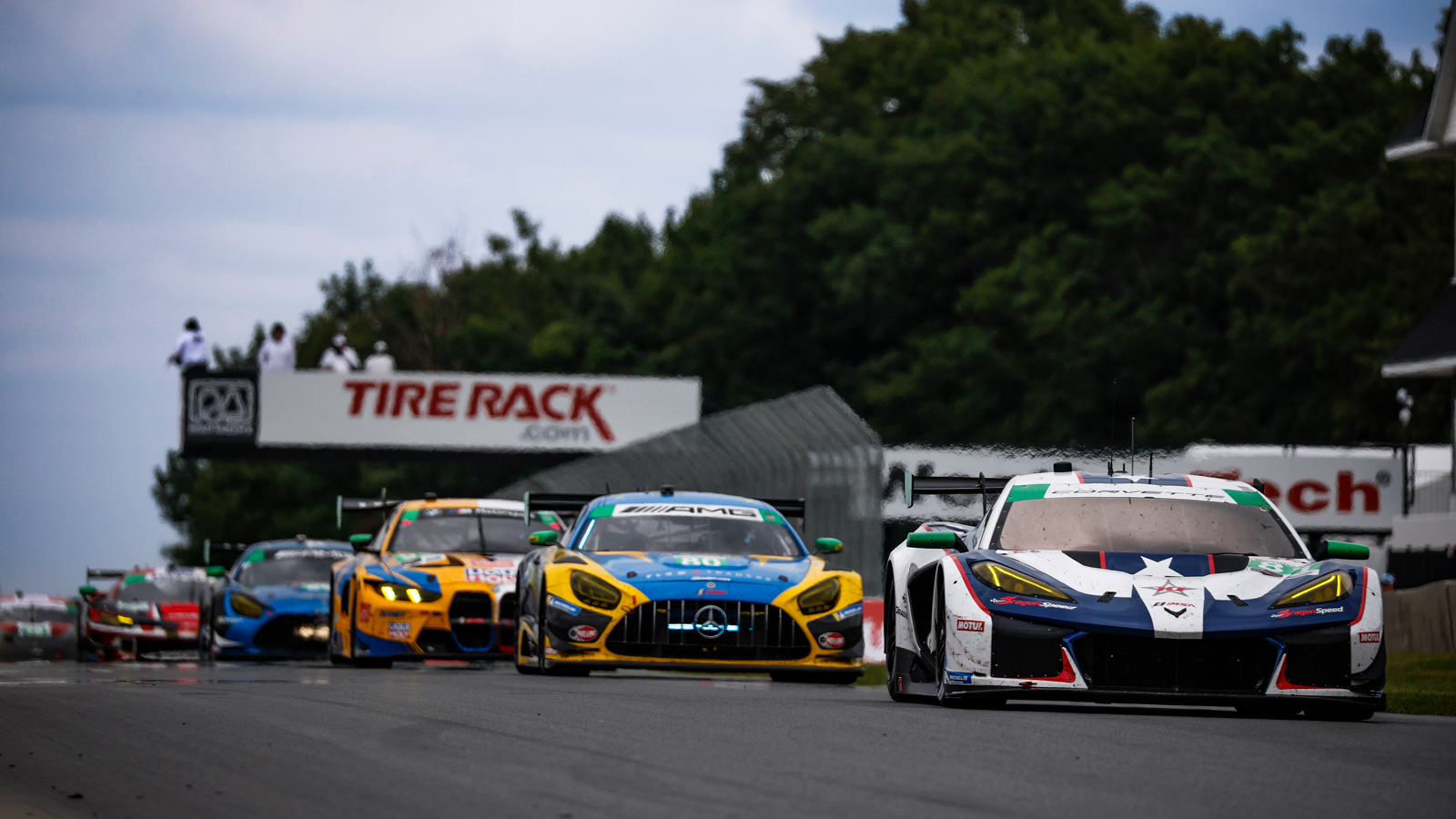 Sports cars race on a straight