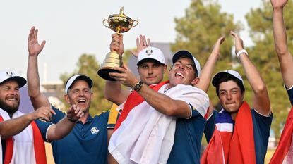 Rory McIlroy lifts the Ryder Cup in front of Team Europe at Marco Simone