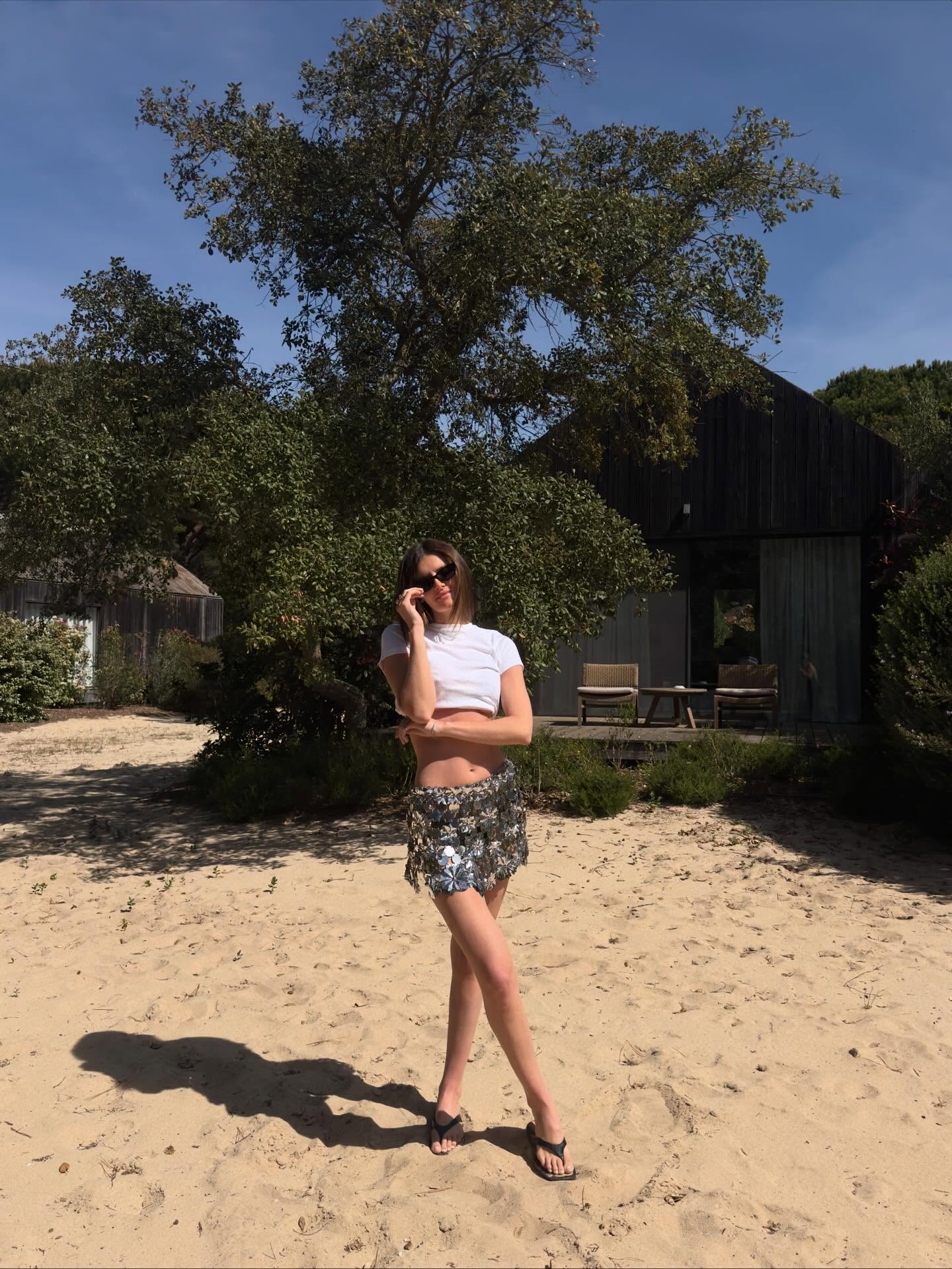 A woman wearing beaded skirt trend for summer 2026.