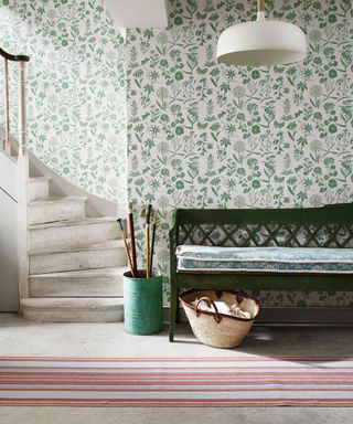 Modern hallway with green botanical wallpaper and bench