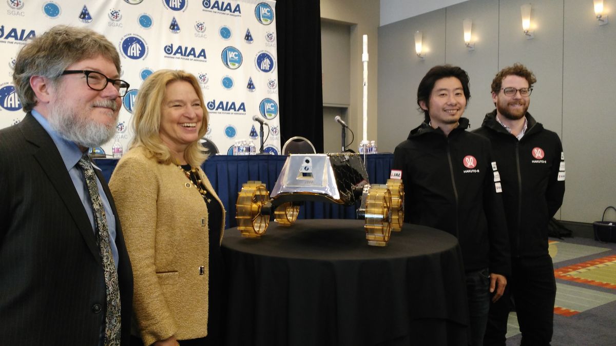 The Sorato rover from Japanese company ispace at the International Astronautical Congress in Washington, D.C., in October 2019, as the spacecraft was handed over for eventual display at the National Air and Space Museum. From left: museum curator Matthew Shindell; the museum&#039;s director, Ellen Stofan; ispace CEO and founder Takeshi Hakamada; and ispace&#039;s John Walker, vice-president of future rover technologies. 