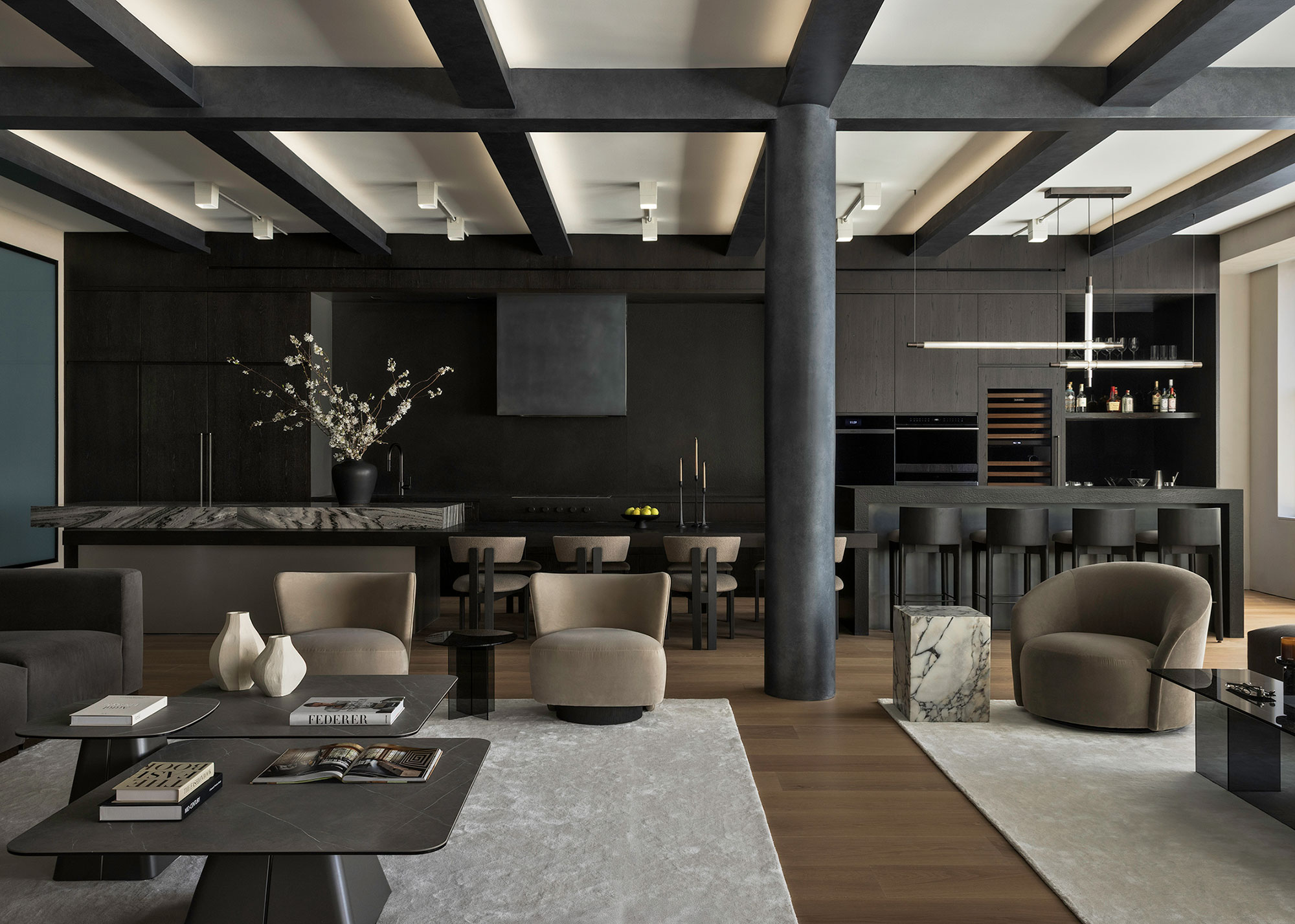 modern open-plan apartment in loft with black walls and furniture, and contemporary furniture