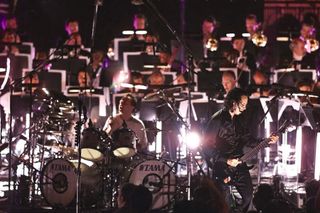 Lars Ulrich and Kirk Hammett onstage with the San Francisco Symphony Orchestra