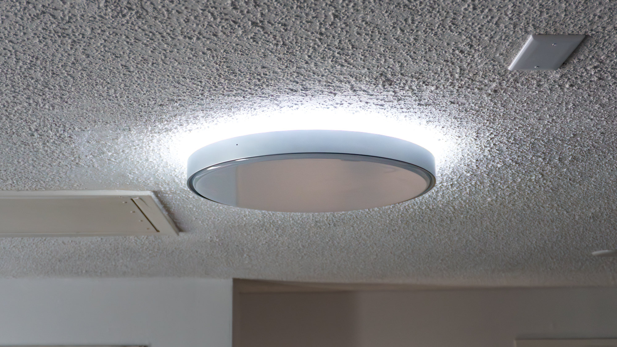 The Govee Ceiling Light Ultra with only the inner ring closer to the ceiling turned on