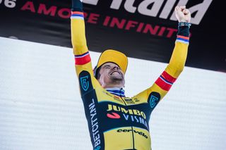 Primoz Roglic celebrates on the podium after winning stage 20 of the Giro d'Italia