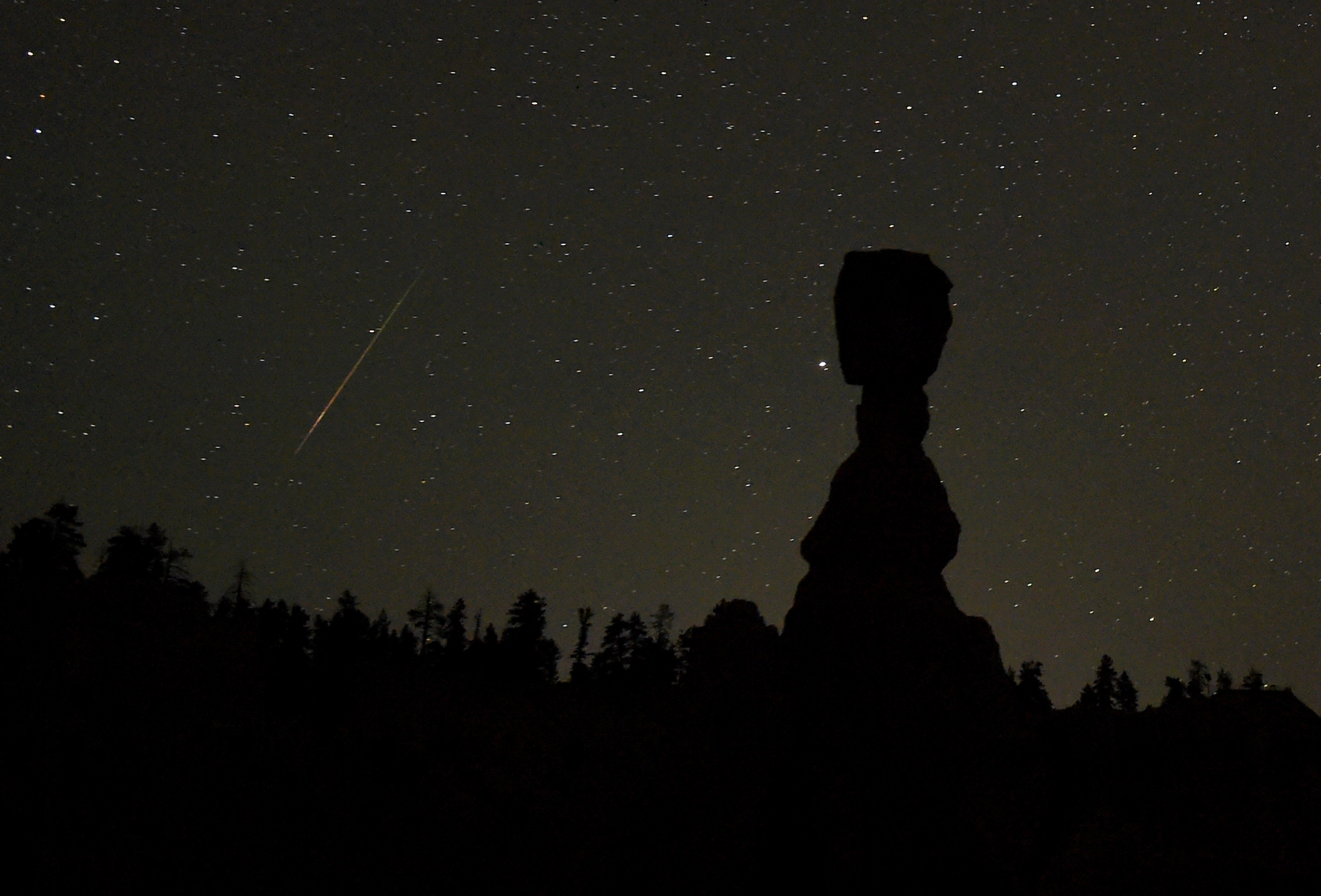 Perseid meteor streaks through Bryce Canyon National Park