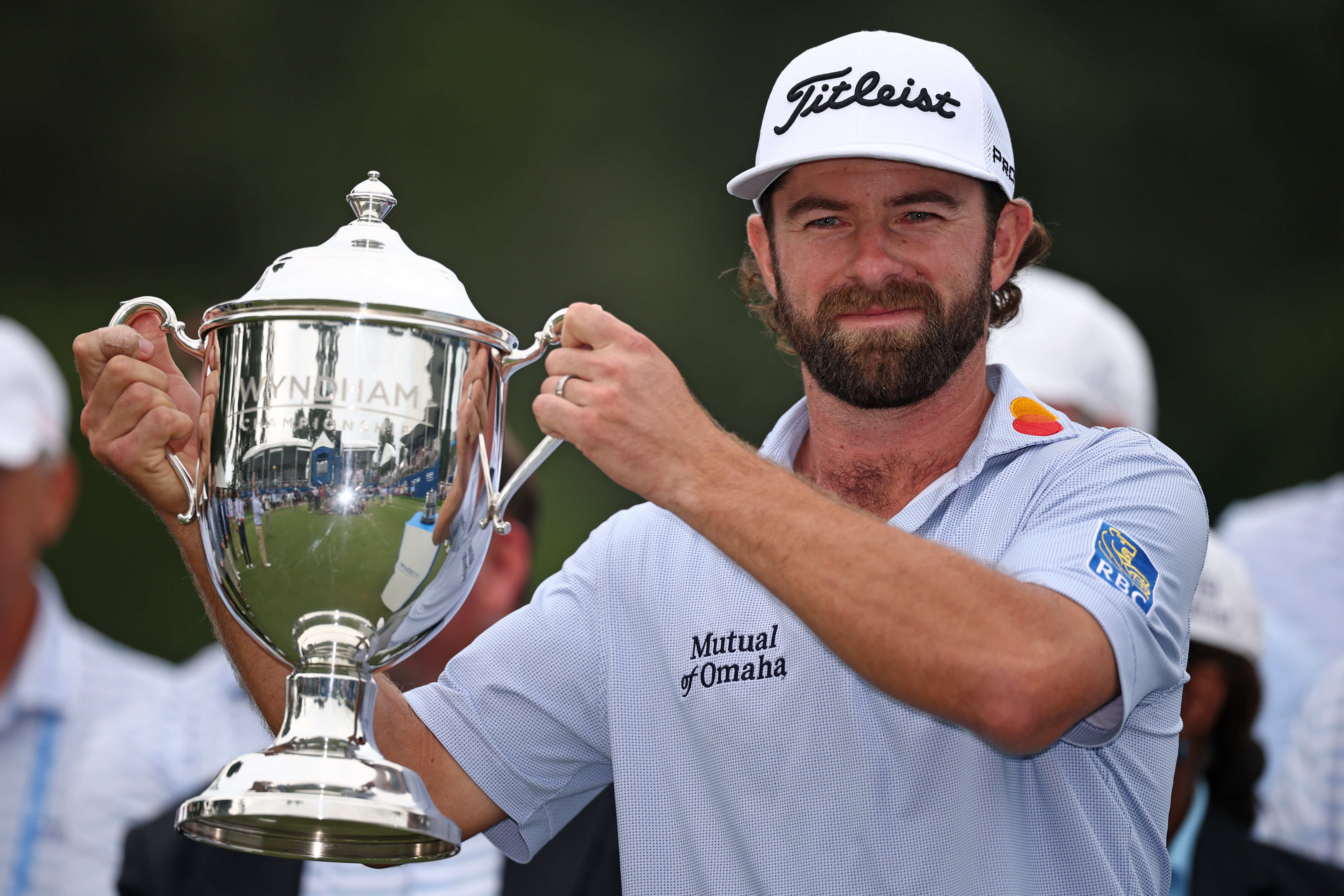 Cameron Young holds the Wyndham Championship trophy