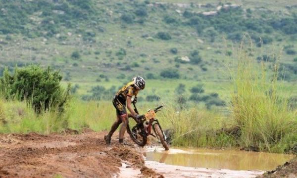 Erderlyi Cluer opts to wash off some mud in a puddle.