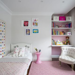 kids room with white bed and white shelves