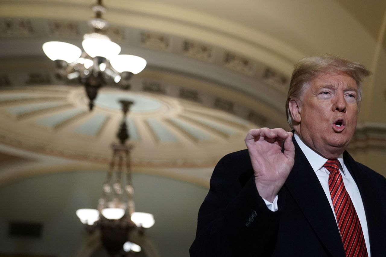 Trump at the U.S. Capitol speaking ot reporters