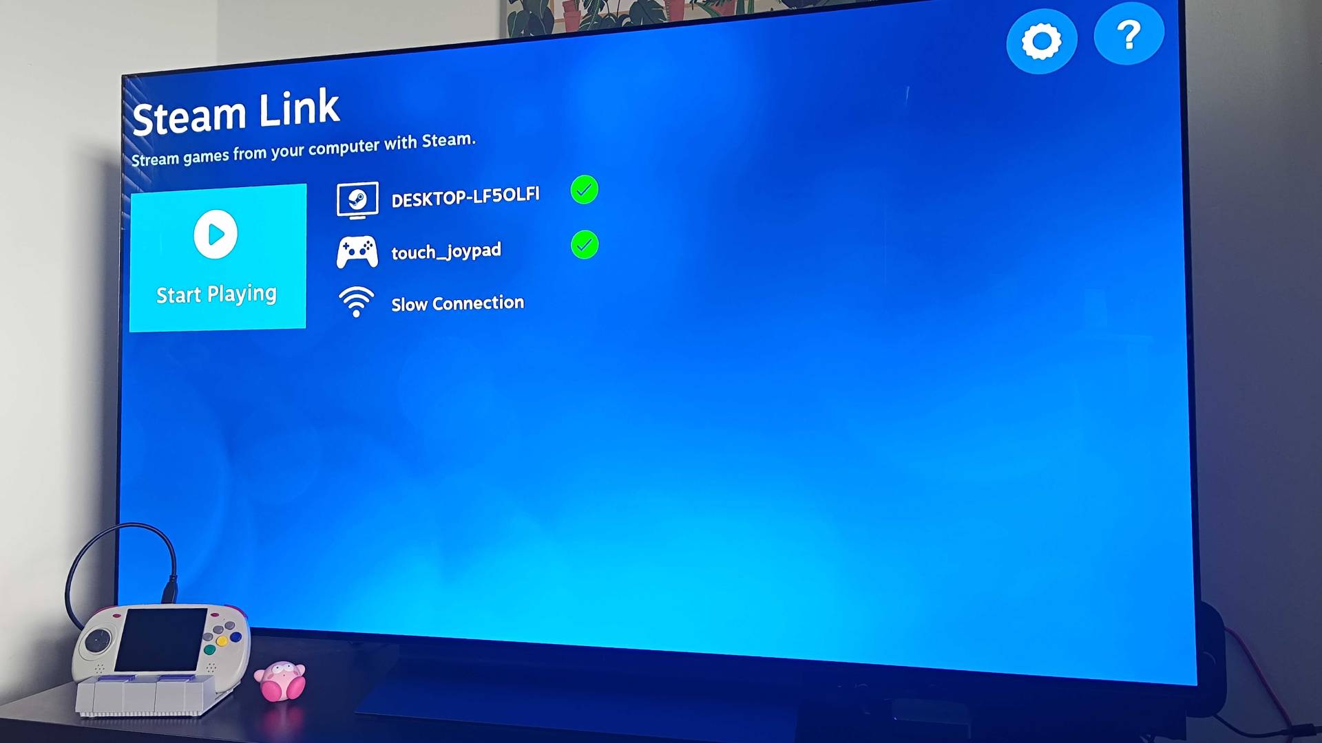Anbernic RG ARC-D connected to LG OLED TV via HDMI with Steam Link setup on screen.