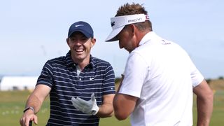 Rory McIlroy and Ian Poulter talk during a practice before the 2022 Open at St Andrews