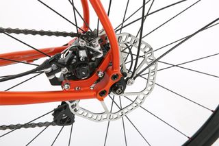 Hybird bikes with disc brakes, like the one in the image, might be more expensive, but offer more consistent braking in all conditions