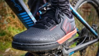 A mountain bike shoe on a pedal