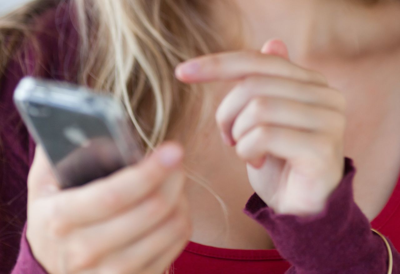 woman using iPhone