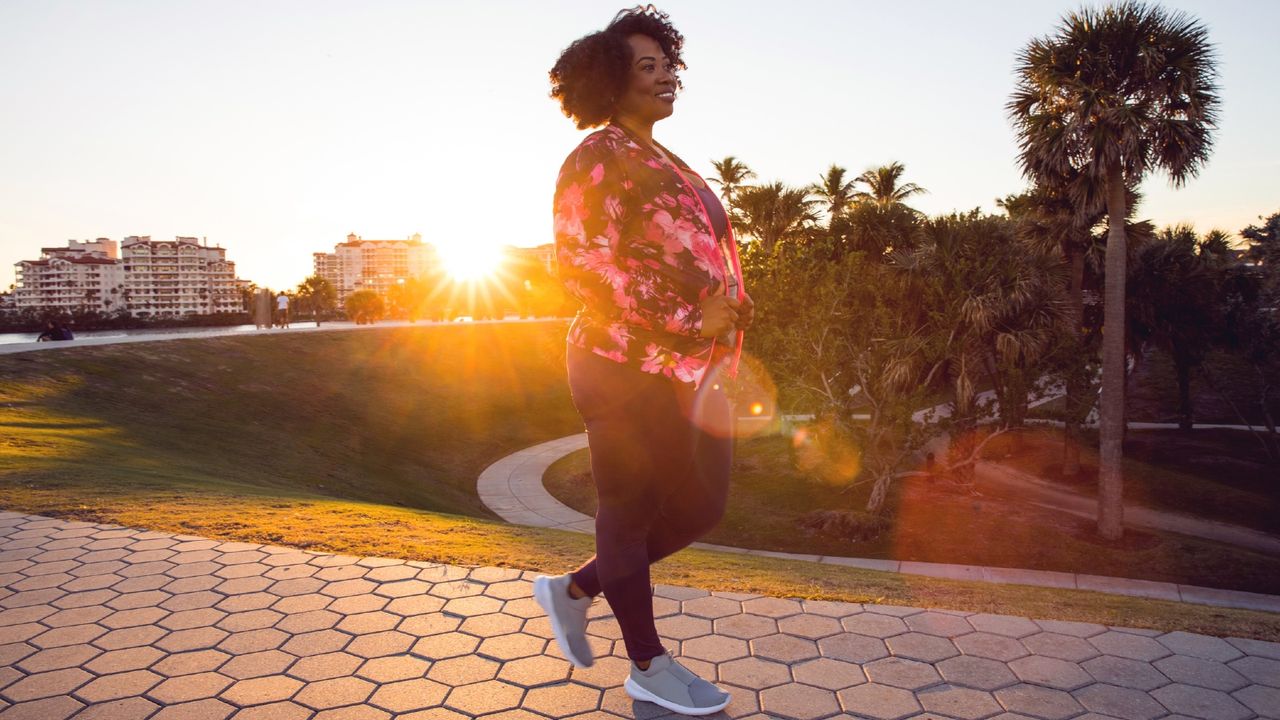 woman walking in the sunset 