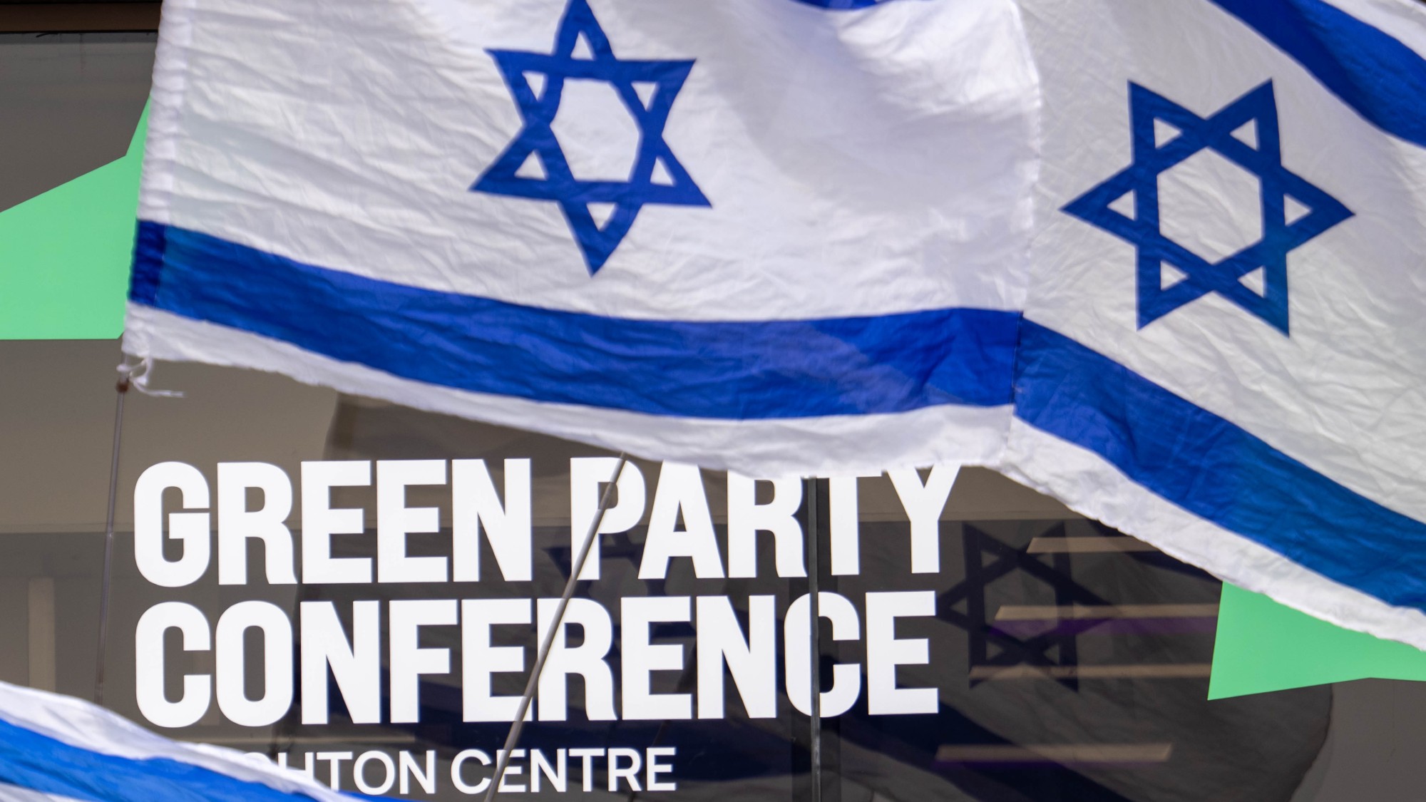 Israeli flags carried by protestors outside the Green Party's Autumn Conference at Brighton Centre