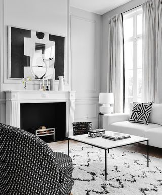 Living room pictures featuring a white living room with white sofa and monochrome accessories.