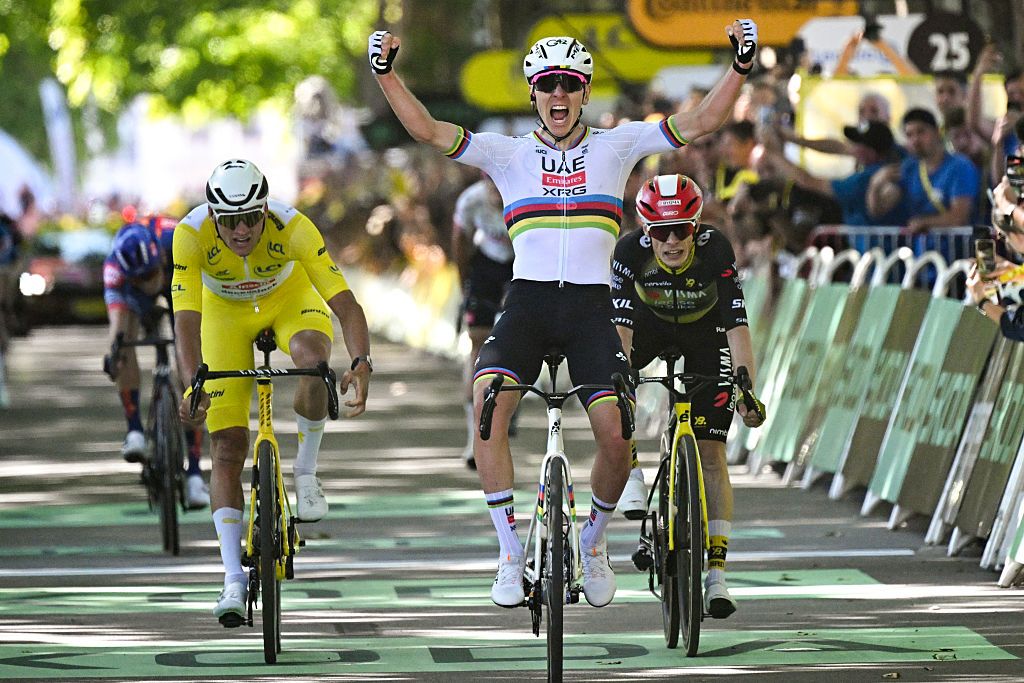 UAE Team Emirate - XRG team's Slovenian rider Tadej Pogacar (C) cycles to the finish line to win ahead of Alpecin - Deceuninck team's Dutch rider Mathieu van der Poel (L) taking second place and Team Visma - Lease a bike team's Danish rider Jonas Vingegaard (R) taking third place during the 4th stage of the 112th edition of the Tour de France cycling race, 174.2 km between Amiens Metropole and Rouen, Northern France, on July 8, 2025. (Photo by Loic VENANCE / AFP) (Photo by LOIC VENANCE/AFP via Getty Images)