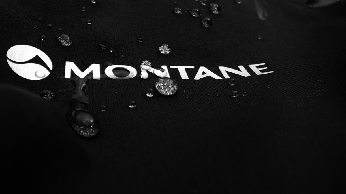 Close up of Montane logo on black waterproof jacket