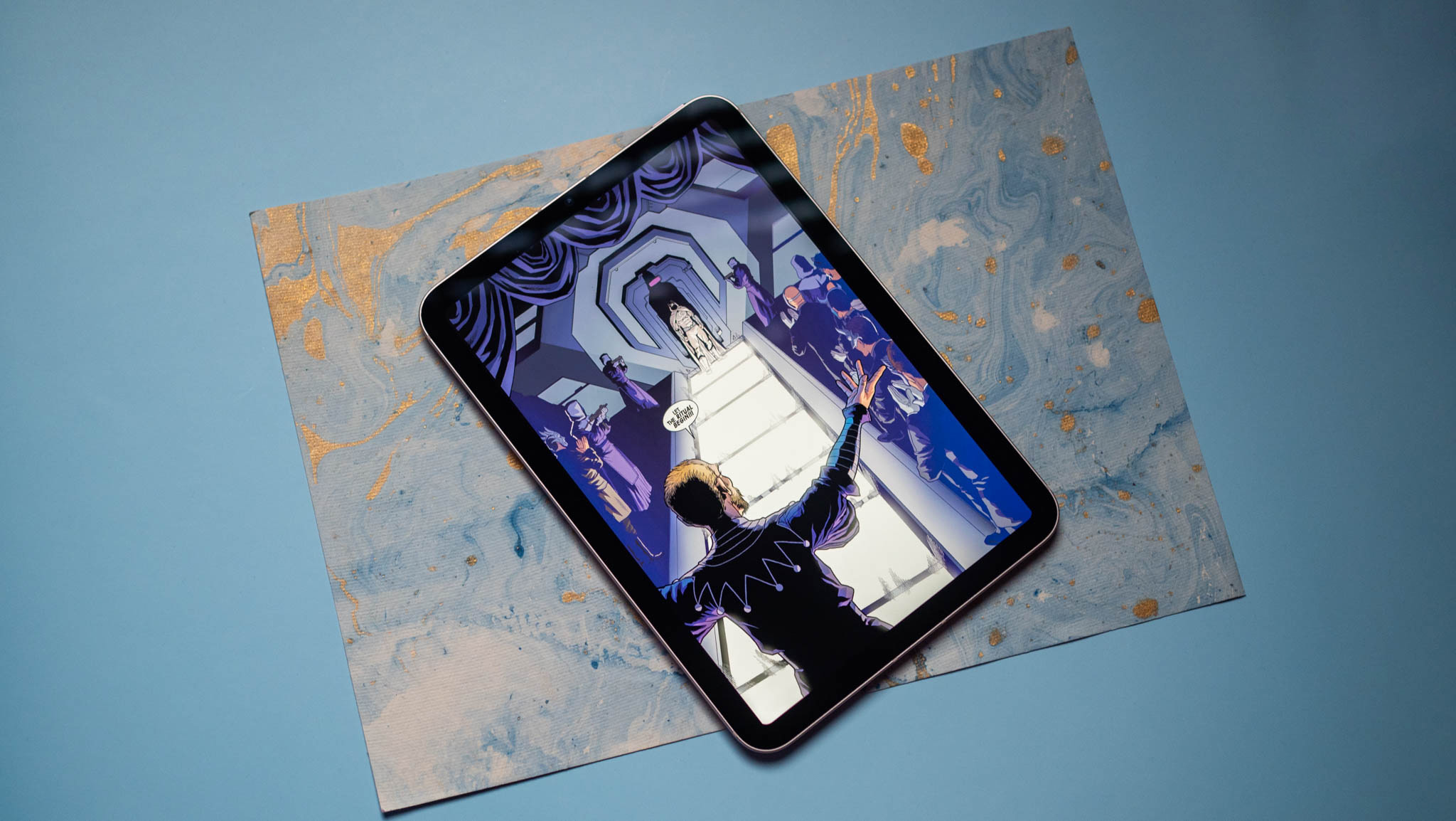 Apple iPad mini with a comic book