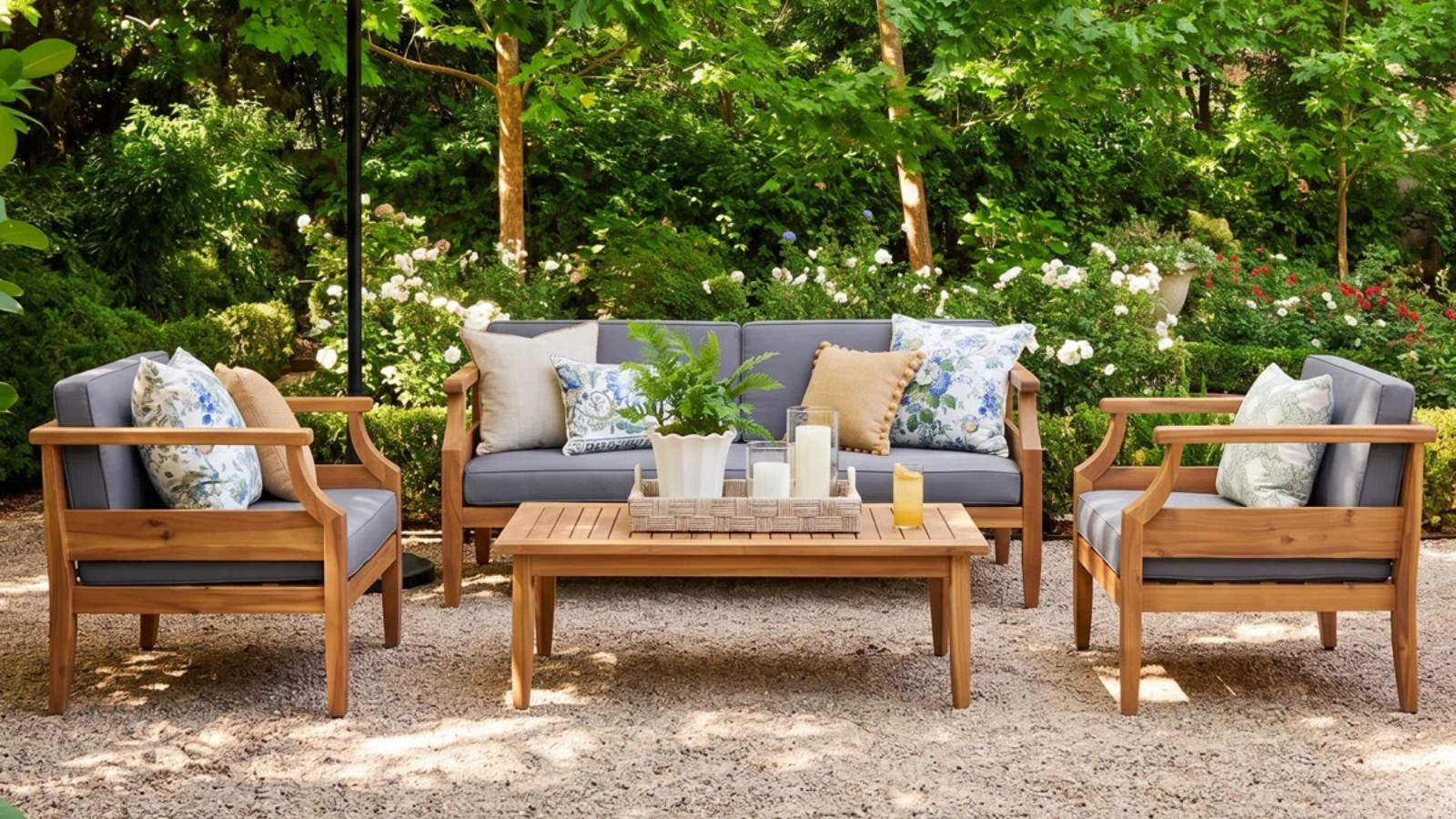 an outdoor seating arrangement with two chairs, a couch, and a coffee table