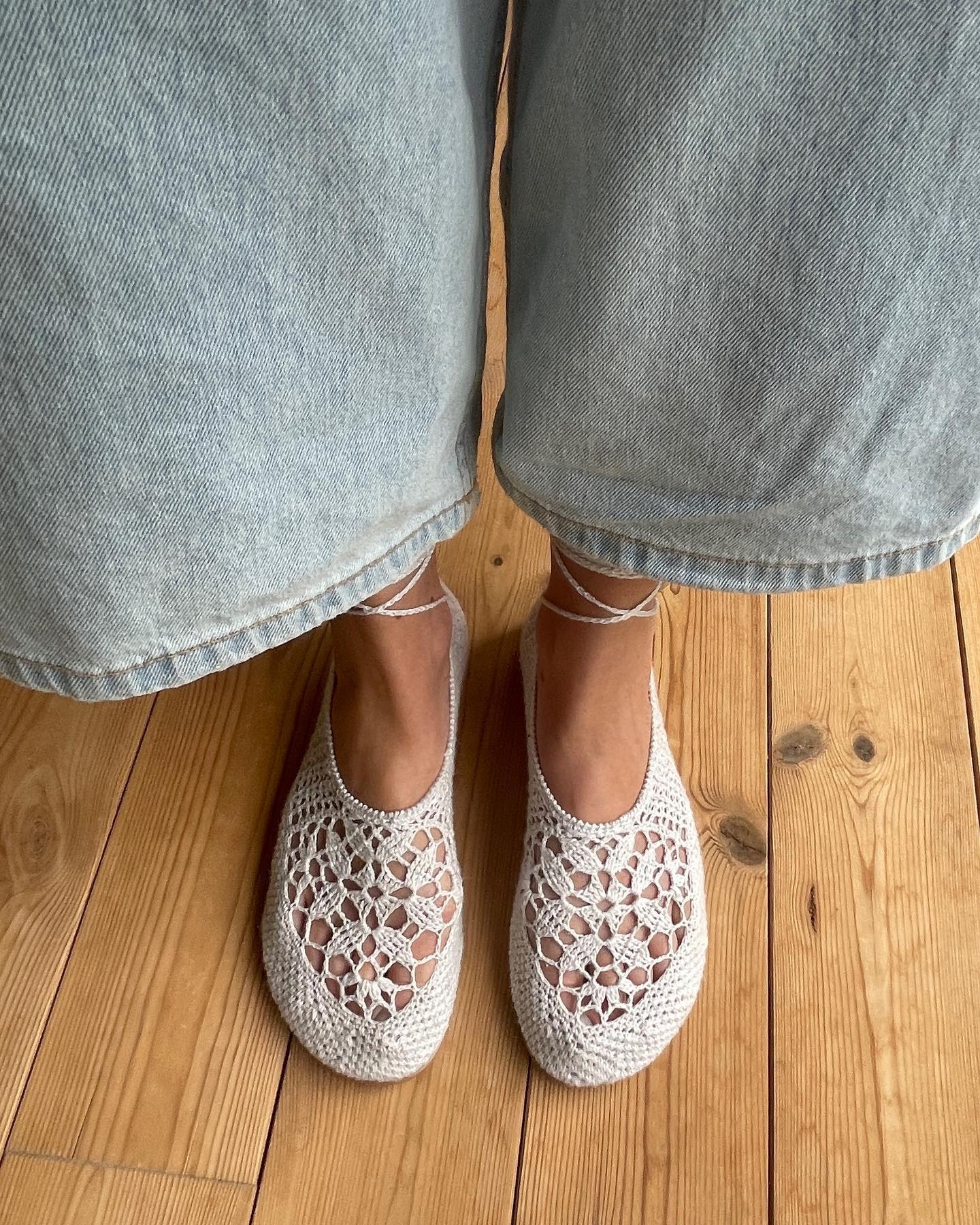 Jeanette Madsen wearing white crochet flats from Hvoya.