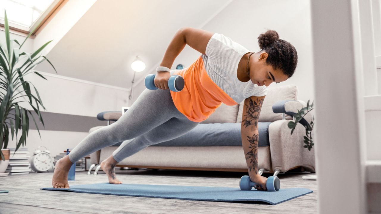 A woman doing a dumbbell workout