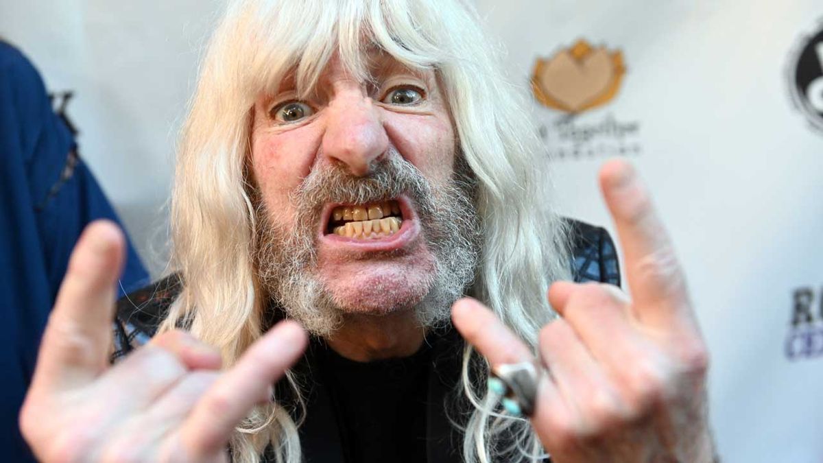 Harry Shearer showing the horns as Derek Smalls