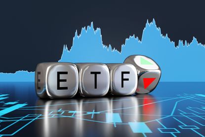 ETF written on silver dice with stock chart in background