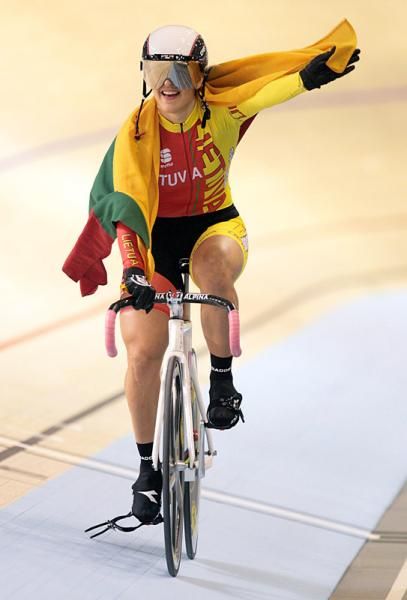Simona Krupeckaite (Lithuania) celebrates with the Lithuanian flag.