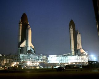 Atlantis, which was being prepared for its STS-38 mission, is seen parked in front of the Vehicle Assembly Building at NASA's Kennedy Space Center in Florida following its rollback from Launch Pad 39A for repairs to the orbiter's liquid hydrogen lines.