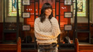 Claudia Winkleman's cable knit jumper in The Traitors