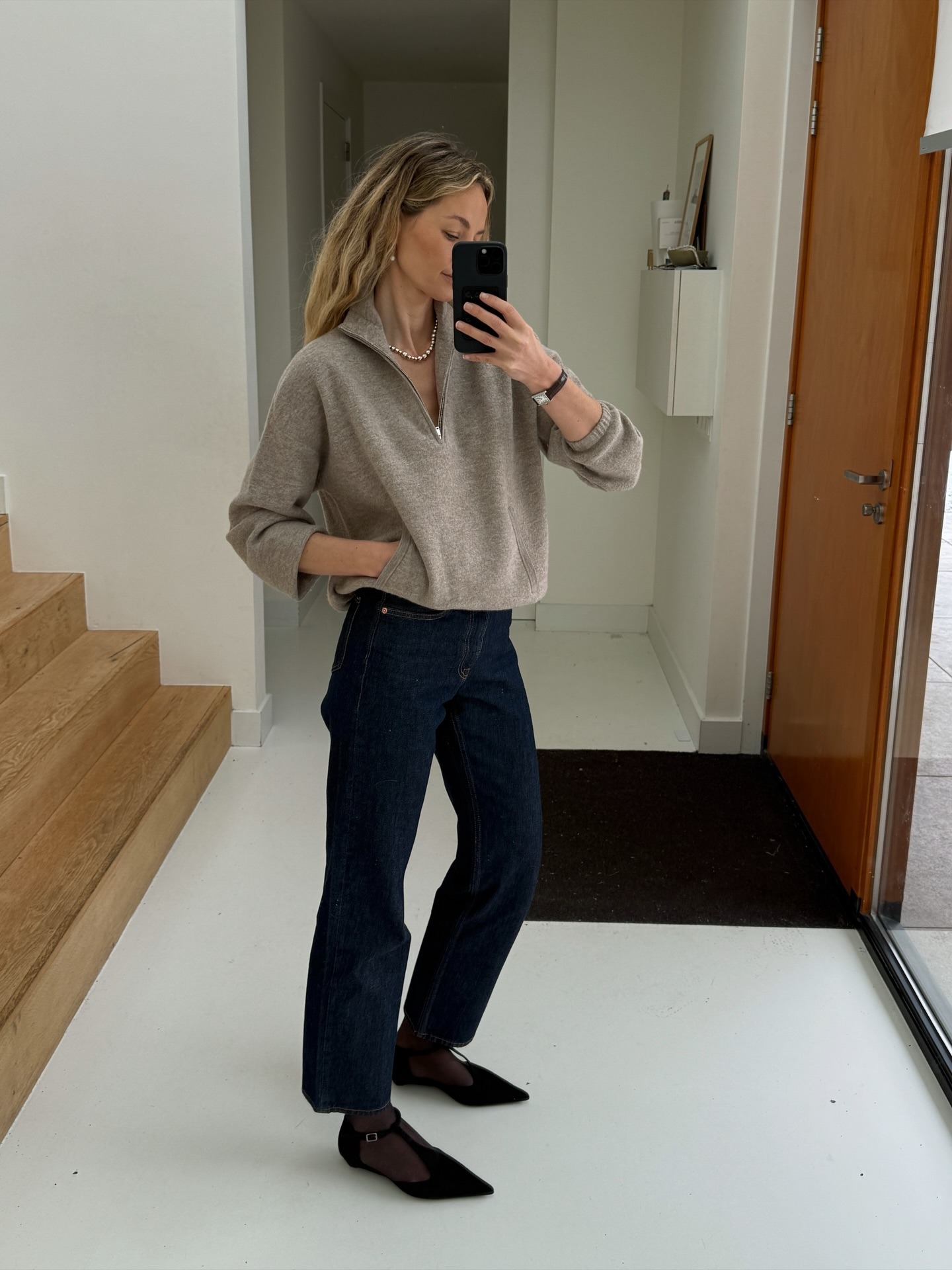 Fashion influencer wearing a quarter-zip pullover