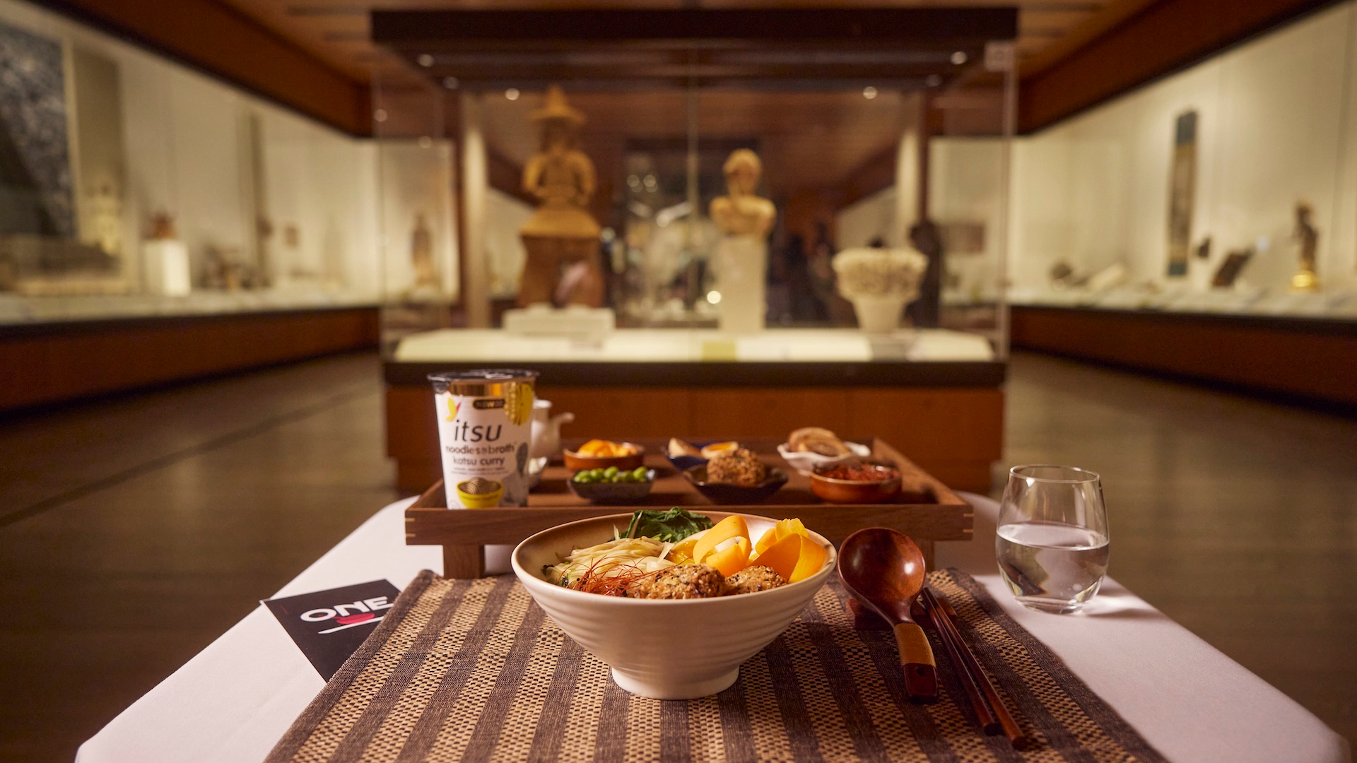 Restaurant for One by itsu in the British Musuem showing a meal in front of Japanese artefacts 