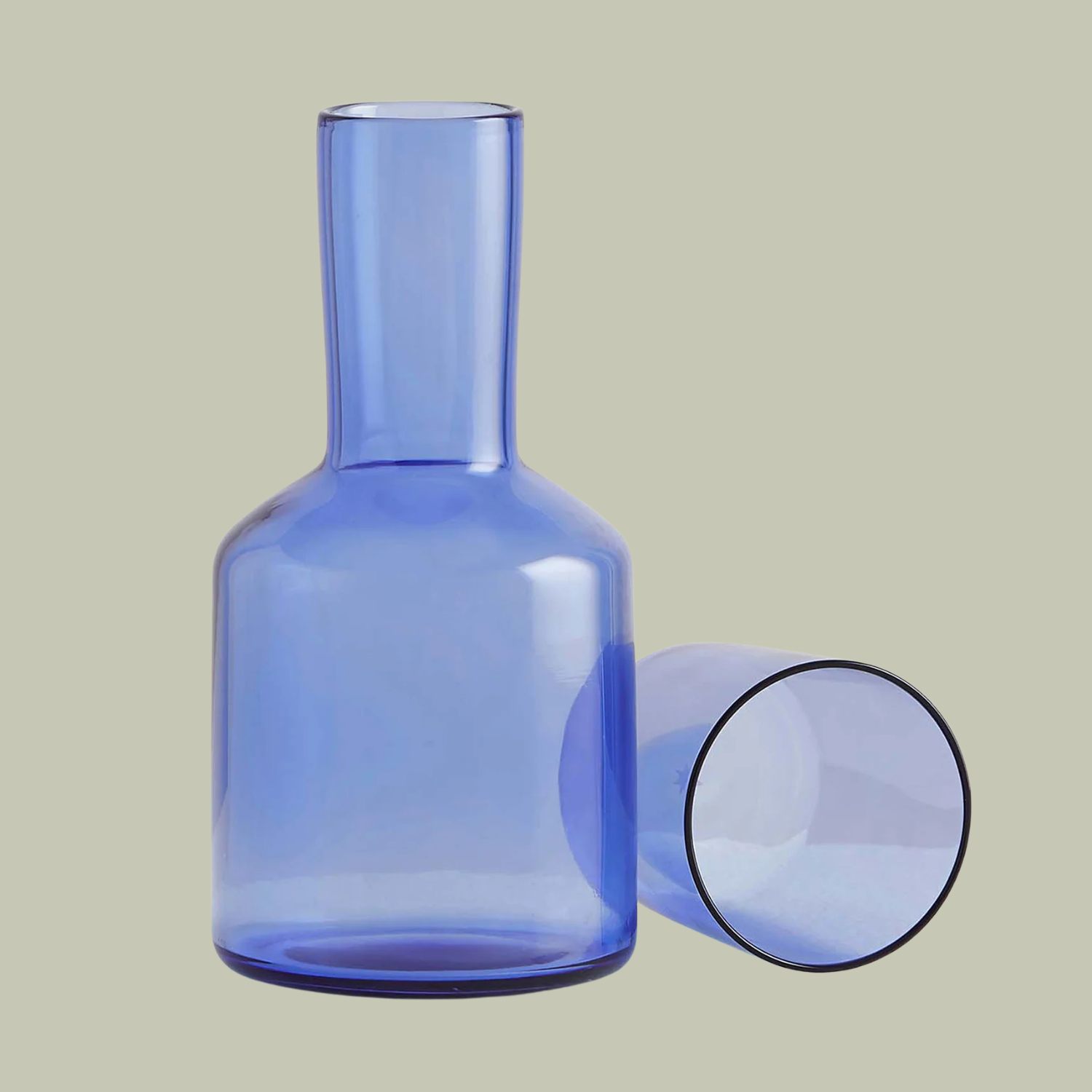 A blue carafe and glass set