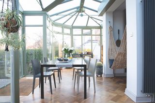 green conservatory with parquet wooden flooring