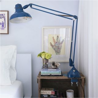 bedroom with white wall and table lamp